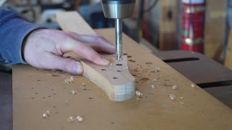 Luthier-Drilling-Holes-At-The-Headstock-For-A-New-Project-To-Insert-Tuners