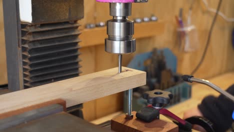 Woodworker-Creating-Handmade-Items-By-Milling-Into-A-Small-Wooden-Beam