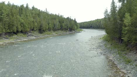 Drone-travelling-upstream-over-salmon-river