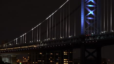 The-metro-crossing-the-Ben-Franklin-Bridge-in-Philadelphia-at-night-with-the-lights-shining-1