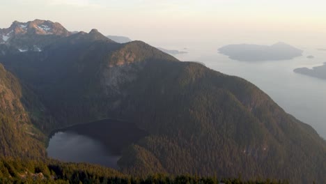 4K-Sunset-Aerial-Drone-Tilting-Up-Shot-Over-Mountain-Lake-Rocky-Landscape-in-Pacific-Ranges-Canada-BC