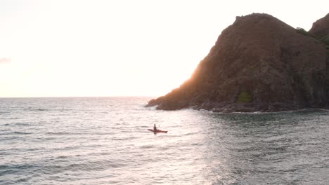 Person-Kayaking-Near-Rocky-Island-Of-Mokulua-At-Sunrise-In-Oahu,-Hawaii