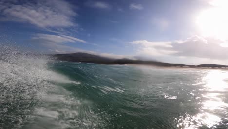 Young-man-surfing-ocean-waves-gopro-angular-view-shot-1
