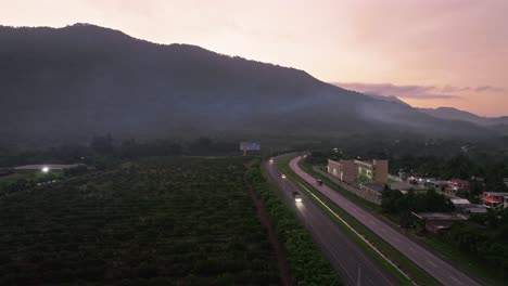 Aerial-shot-of-traffic-on-highway-in-Villa-Altagracia-during-foggy-morning-in-Dominican-Republic