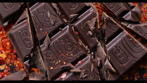 Top-down-close-up-of-broken-pieces-of-a-chocolate-bar,-background-with-no-people,-Mexican-cocoa