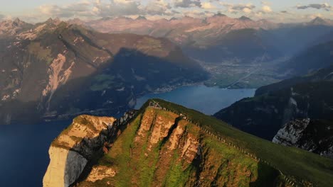 Aerial-flyover-towards-the-summit-of-Niederbauen-Chulm-with-a-view-of-Uri-and-Lake-Lucerne-fjords-on-a-summer-evening-in-the-Swiss-Alps