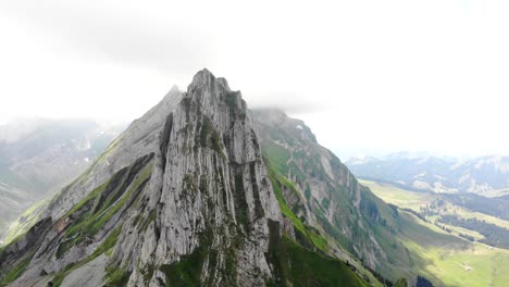 Aerial-flyover-around-Altenalpturm-peak-at-the-Schafler-ridge-in-Appenzell,-Switzerland