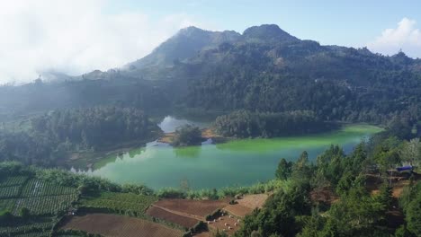 Aerial-view-of-TELAGA-WARNA-Lake-in-Dieng-Park,Central-Java,Indonesia-during-sunny-day