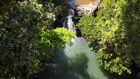 Descending-aerial-crane-shot-over-two-waterfalls,-Costa-Rica