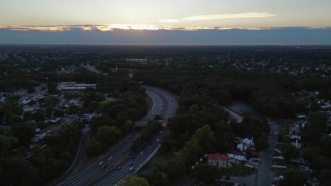 An-aerial-time-lapse-of-a-highway-at-sunrise