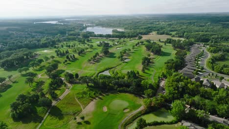 Aerial-drone-shot-of-a-golf-course-with-multiple-golf-holes-in-view