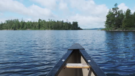 POV-from-canoe-bow-on-a-sunny-day-in-the-boundary-waters-canoe-area-wilderness