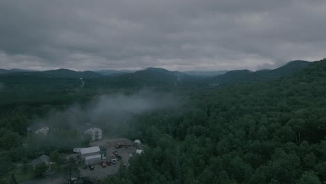 Drone-move-up-revealing-at-beautiful-foggy-mountain-top-landscape