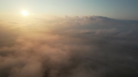An-aerial-view-high-above-the-clouds-during-a-beautiful-sunrise