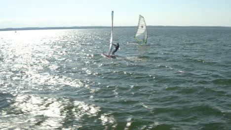 A-fantastic-view-of-a-couple-of-windsurfers-floating-on-the-open-water
