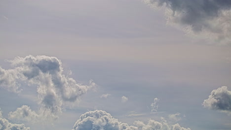 Shot-of-fluffy-white-cumulus-clouds-movement-in-timelapse-at-daytime