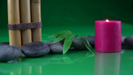 Bamboo-stalks-leaf-and-red-candle-invoking-tranquility-and-peace
