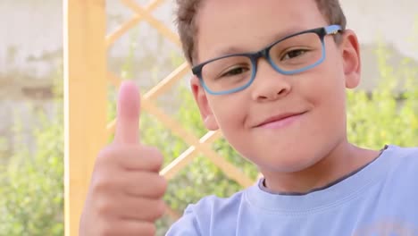 Boy-with-a-pair-of-glasses-looking-stylish-and-cool-stock-footage-1