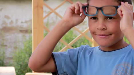 Boy-with-a-pair-of-glasses-looking-stylish-and-cool-stock-footage