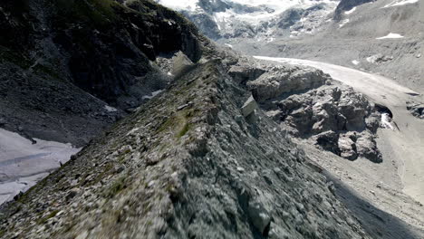 Aerial-FPV-like-shot-moving-forward-tracing-the-shape-of-the-mountain-in-Zinal,-Switzerland