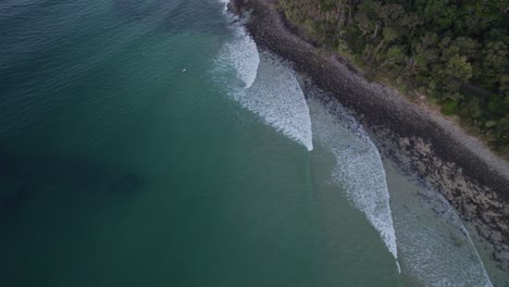 Overhead-View-Of-Surfers-At-Little-Cove-Beach-Near-Noosa-National-Park-In-Queensland,-Australia