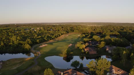 A-green-golf-course-may-be-seen-next-to-Lake-Geneva,-a-city-on-Geneva-Lake-in-southeast-Wisconsin-with-two-lakes