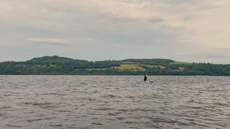 Young-Man-Paddleboarding-Around-The-Shore-Of-Loch-Lomond