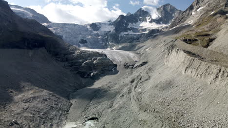 Aerial-shot-towards-the-huge-glacier-in-Zinal,-Switzerland,-getting-very-close