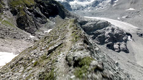 Very-fast-aerial-FPV-like-shot-moving-forward-tracing-the-shape-of-the-mountain-in-Zinal,-Switzerland