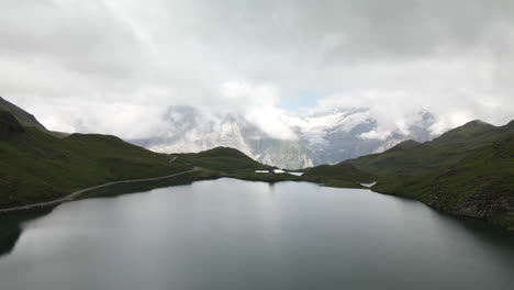 Bachalpsee-lake-in-the-shadows-of-the-clouds-with-the-Eiger-in-front-with-sunlight-2