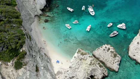 There-are-trees-along-the-hillside-of-the-Italian-island-of-Tremiti,-which-has-a-white-sand-beach-and-stunning,-clear-waters-of-the-Adriatic-Sea