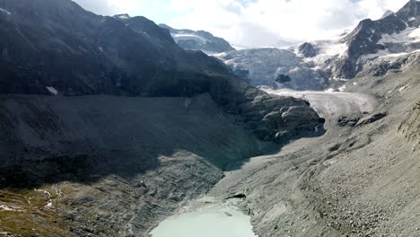 Aerial-view-approaching-to-an-enormous-glacier-in-Zinal,-Switzerland