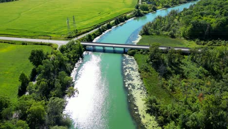Average-simple-small-concrete-bridge,-road-over-river-in-rural-countryside-area
