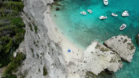 Drone-footage-was-taken-from-over-Tremiti-Island,-where-people-were-seen-swimming-and-strolling-along-the-beach