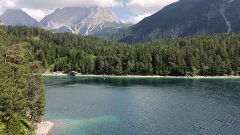 People-stand-up-paddle-on-Blindsee-in-Tyrol-in-Austria-during-Summer-Time