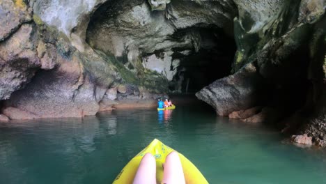 Go-Pro-perspective-slow-motion-of-girl-in-kayak-going-into-cave-on-tour-in-Thailand-Phang-Nga