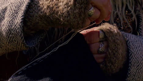 Viking-craftsman-making-woolen-clothes-using-historical-materials