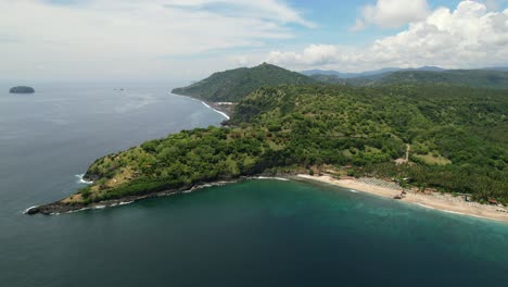 Beautiful-aerial-of-Pantai-Prasi-in-East-Bali-on-sunny-day-with-blue-ocean-coastline