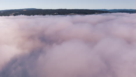 Coastal-fog-rolls-in-over-the-low-elevations-of-Santa-Cruz,-California---time-lapse