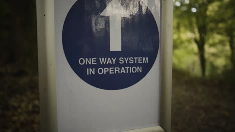 One-Way-System-In-Operation-Sign-With-Upward-Arrow-At-The-Kennall-Vale-Nature-Reserve-In-England
