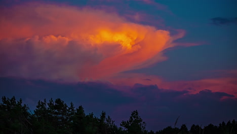 Time-lapse-shot-of-golden-sunset-clouds-changing-to-dark-storm-clouds-in-the-evening-outdoors-in-nature