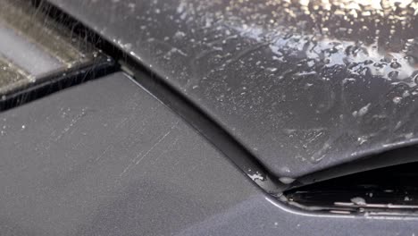 Close-Up-Spray-of-Liquid-Coating-on-Car-Exterior