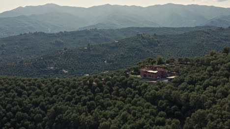 Flying-over-house-on-top-of-a-hill-in-Liguria