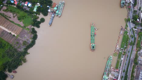 Aerial-Birds-Eye-View-Of-Liquid-Tanker-Being-Pushed-By-Tugs-On-Chao-Phraya-River