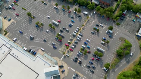 Drone-flying-above-the-car-park-of-a-retail-district
