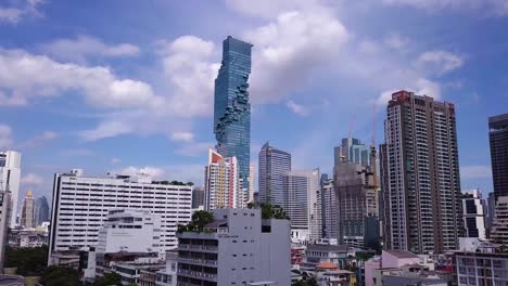 Drone-shots-of-King-Power-Mahanakhon-tower-in-Bangkok,-Thailand
