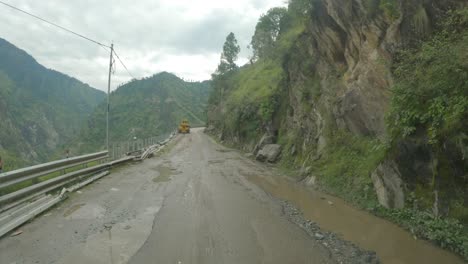 A-point-of-view-shot-of-driver-riding-through-most-dangerous-road-in-Shimla-Kinnaur-road-in-the-month-of-August-after-the-landslide
