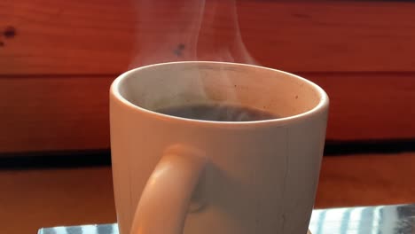 Steam-wafting-up-from-a-hot-mug-of-coffee