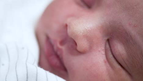 Close-Up-Portrait-Of-Sleeping-New-Born-Indian-Baby-Boy-Showing-Small-Dimples-On-Nose