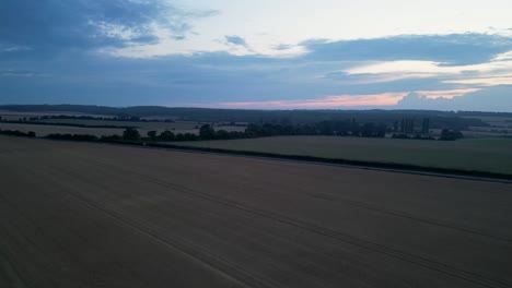 Speedy-aerial-flyover-of-a-wheat-field-at-dusk